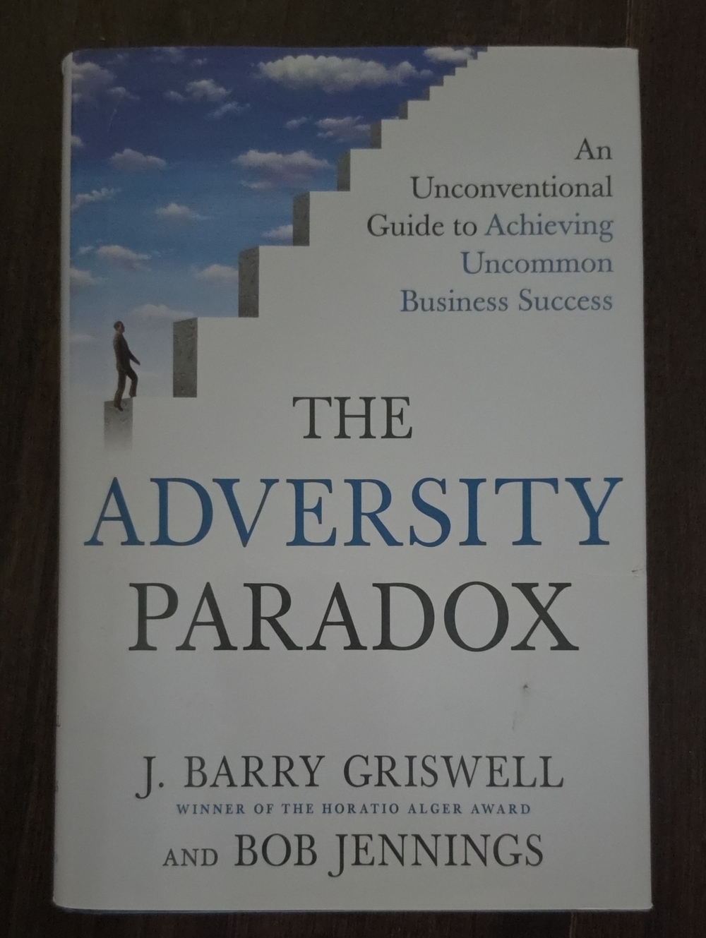 The Adversity Paradox by J. Barry Griswell & Bob Jennings - White/Blue Cover